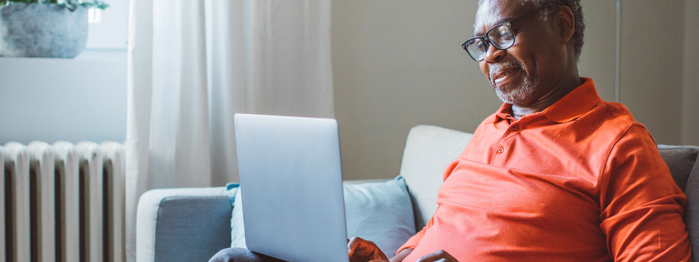 Mature man using laptop